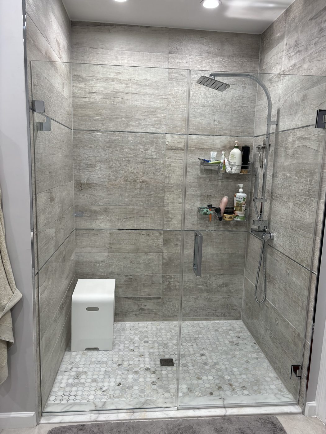 Glass shower enclosure