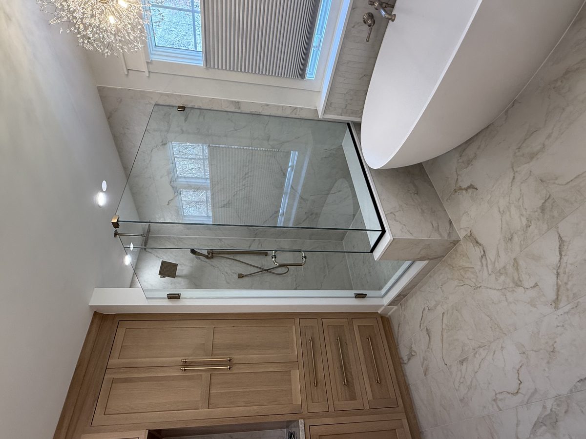 Frameless glass railing on a home staircase