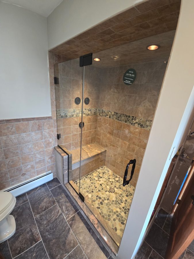 Frameless corner shower enclosure