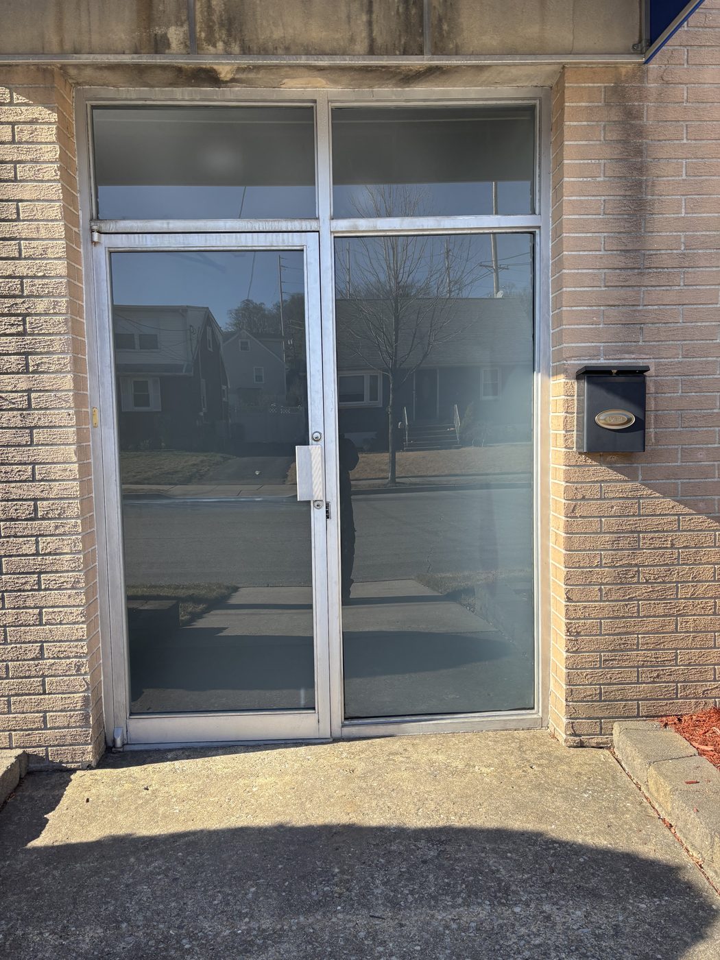 Aluminum storefront entrance door with sidelite and transoms