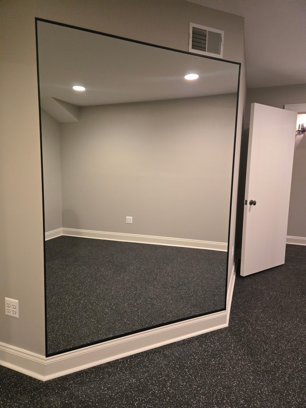 Oversized custom wall mirror in a fitness studio