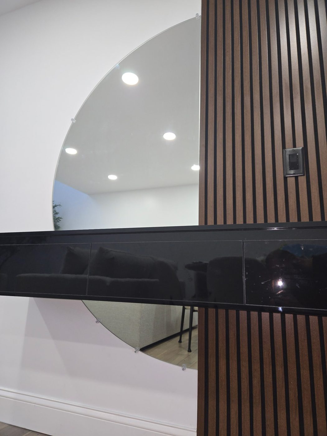 Glossy black back-painted glass accent panel