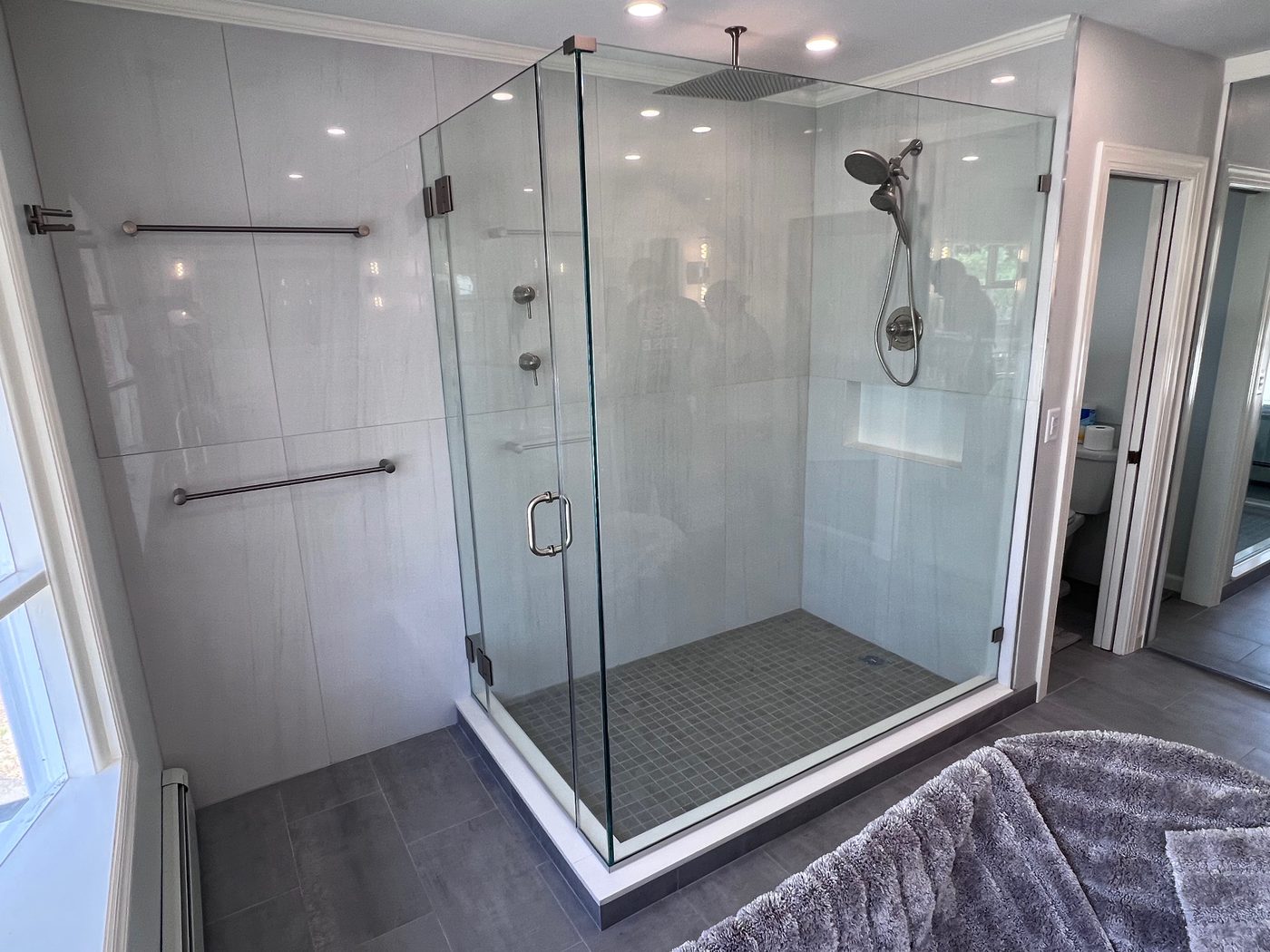Frameless corner glass shower with black hardware